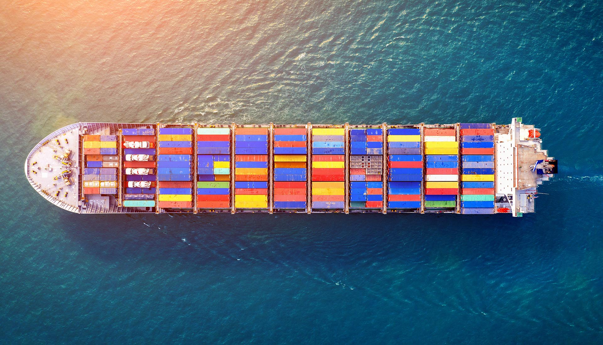 Aerial view of container cargo ship in sea.