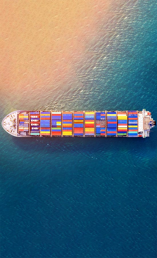 Aerial view of container cargo ship in sea.