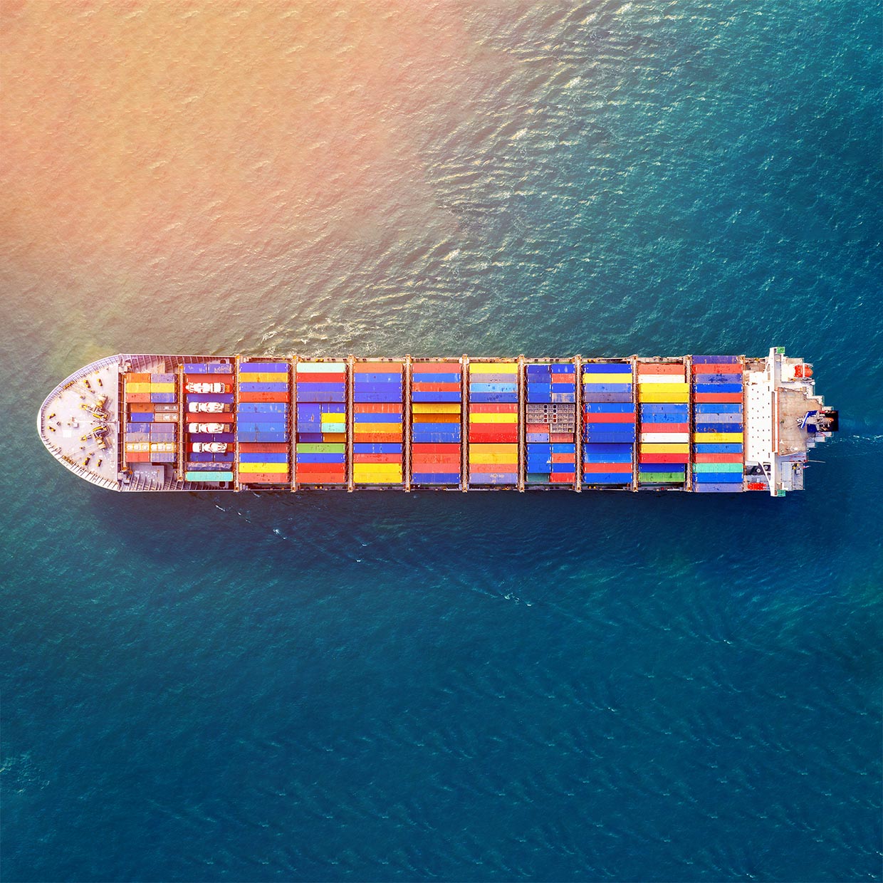 Aerial view of container cargo ship in sea.